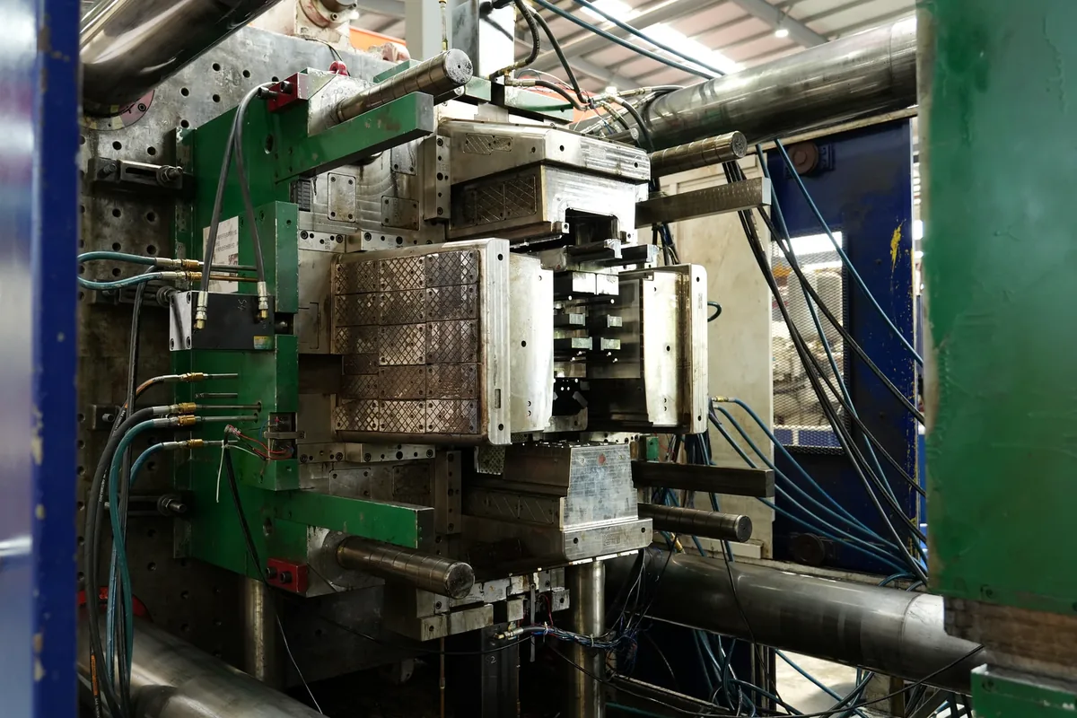 Large Injection Mold Installed in Machine Large injection mold installed in a 1600-ton injection molding machine